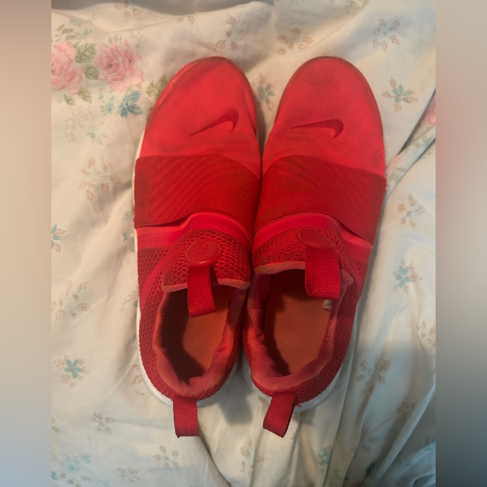 red Nike tennis shoes